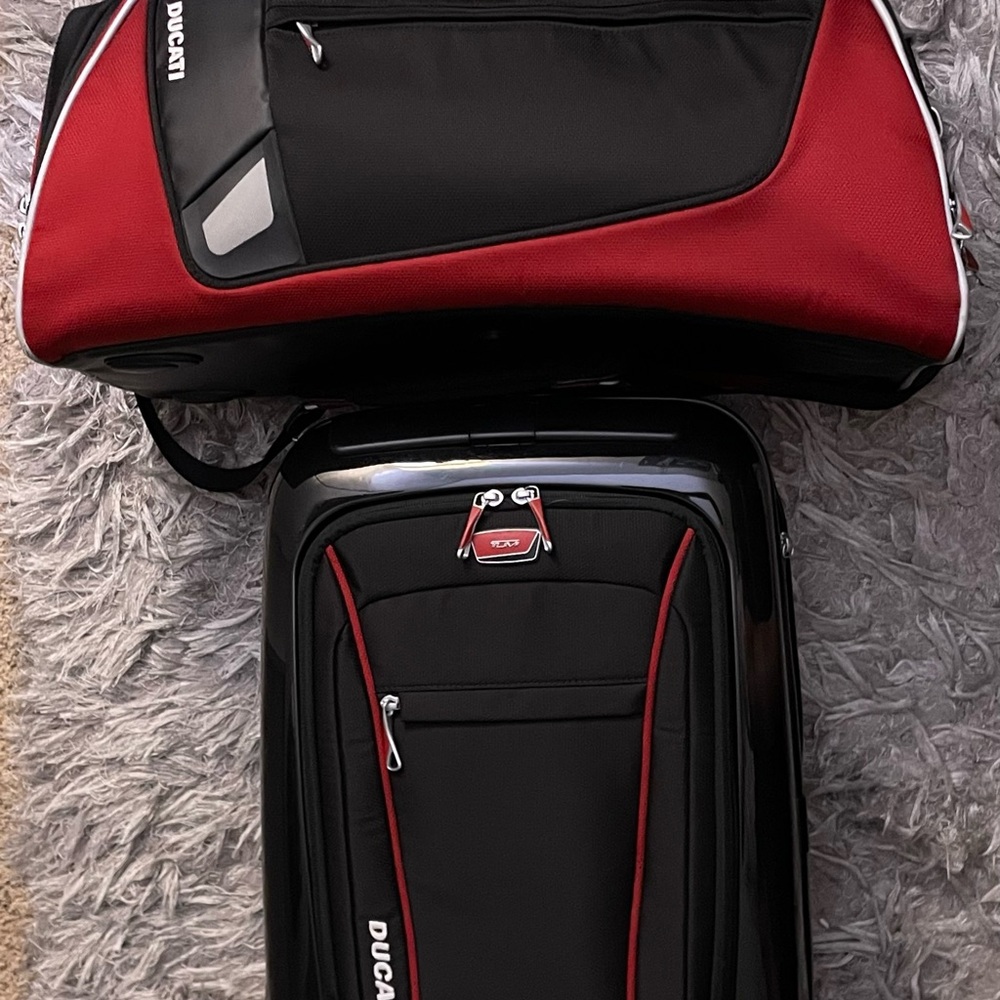 Tumi Ducati Black and Red Duffel Bag and carry on suit case.RARE HARD TO FIND